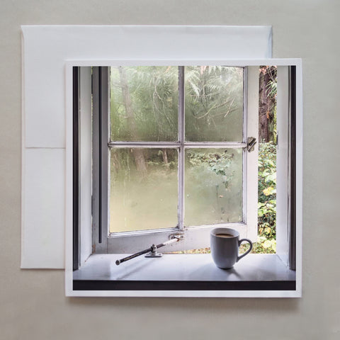 This greeting card shows a mug of coffee with bailey's on the ledge of an open window by photographer Jennifer Echols.