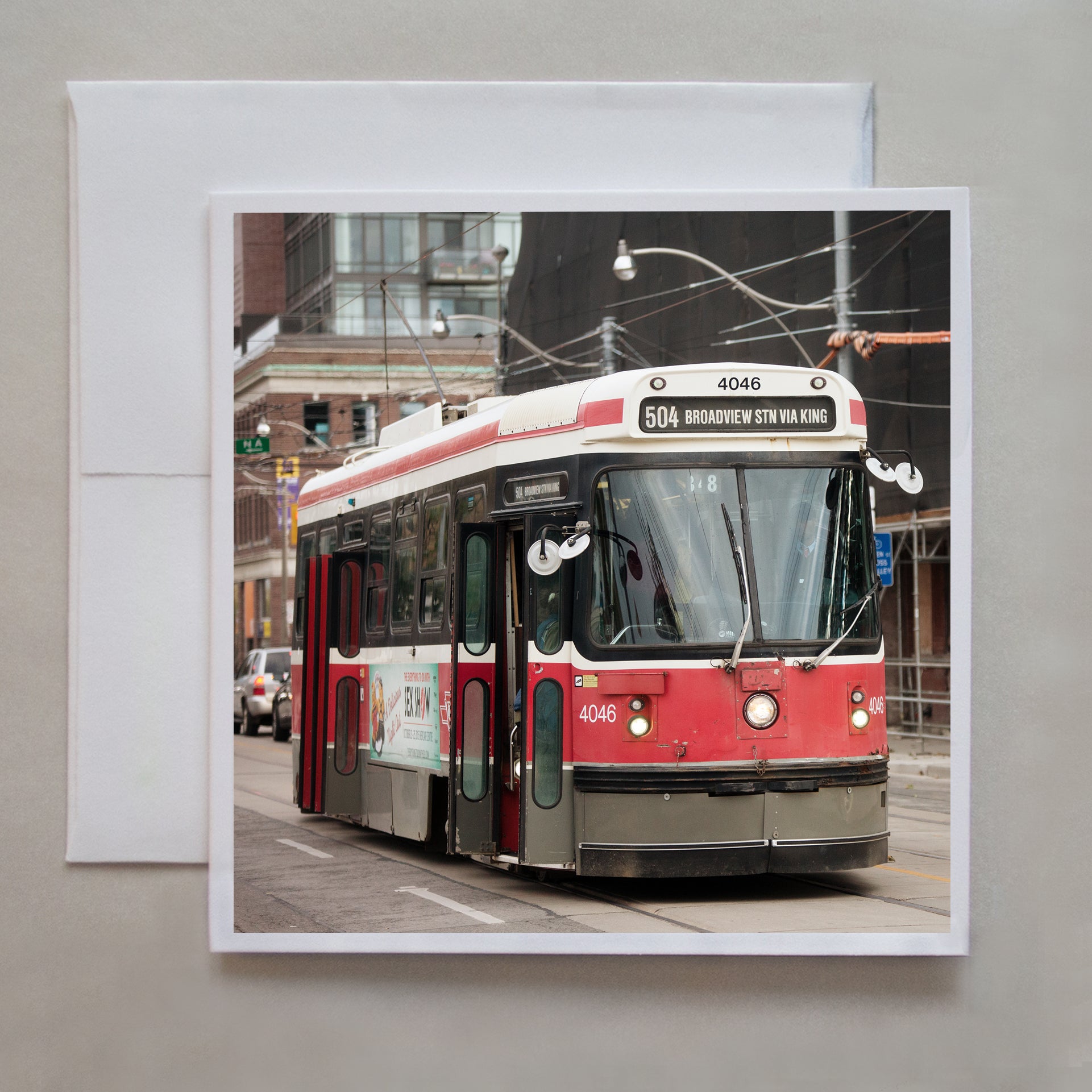 The old 504 Toronto streetcar is opening it's doors to passengers in this photo greeting card by photographer Caley Taylor.  