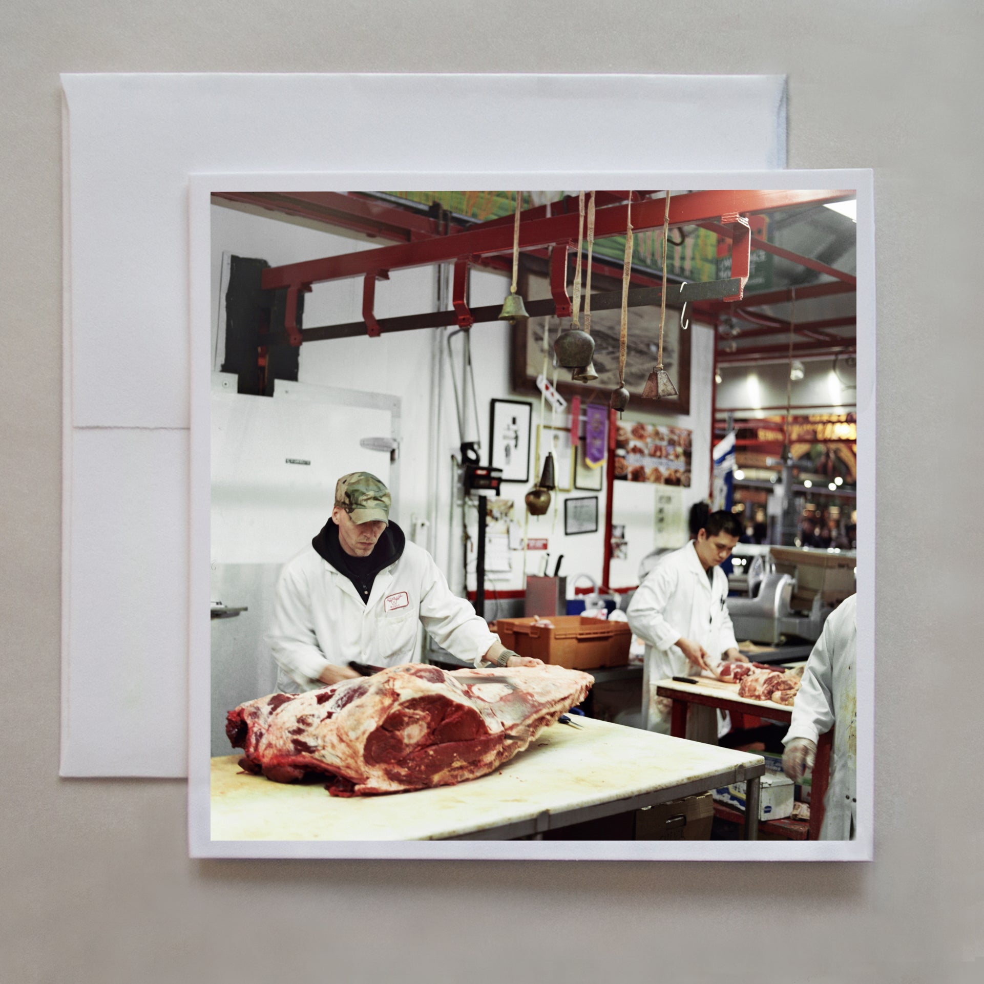 A favourite family activity (pre-Covid) was shopping on Saturday morning at the St. Lawrence Market in Toronto, often for a dinner party we might be hosting that weekend. This 6x6 film photograph shows the Upper Cuts Meat butcher working on steaks by photographer Caley Taylor.