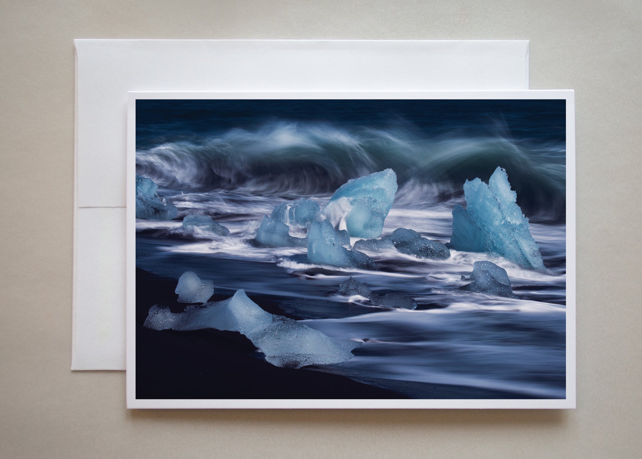 Photographer Alicia Campbell uses a long shutter speed to capture the blue, rolling waves in this icy beach greeting card.