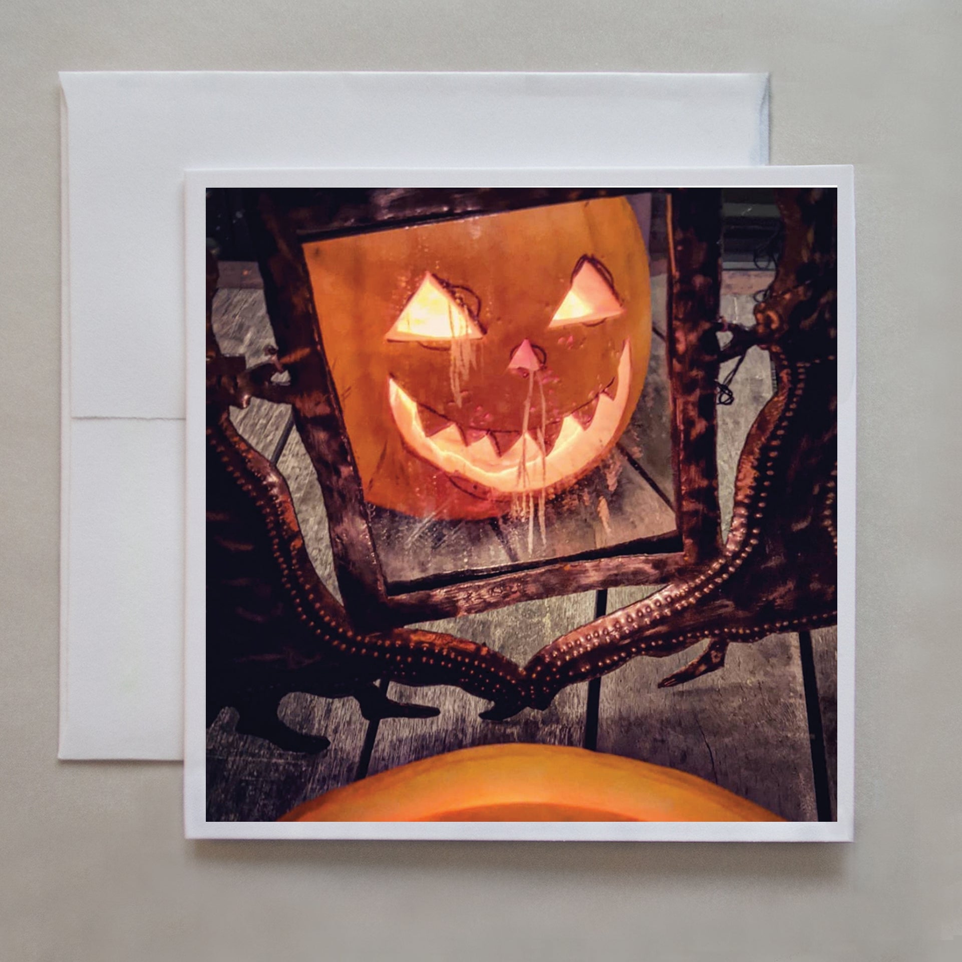 A Halloween greeting card of a Jack-O-Lantern reflected in a spooky mirror by photographer Jennifer Echols.