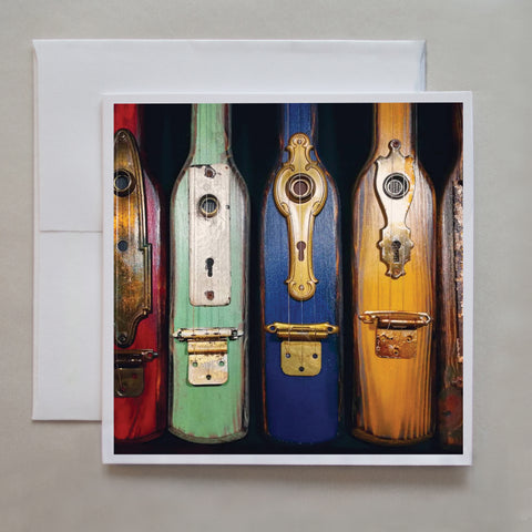 What type of musical instrument is this?  (message me if you know!) Taken in the southern US, this photo card shows a row of colourful 3-string musical instruments by photographer Jennifer Echols. 