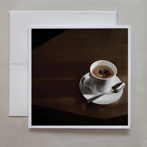 The photo card shows morning side light hitting a cup of tea at the fancy Ritz hotel by Toronto photographer Caley Taylor.